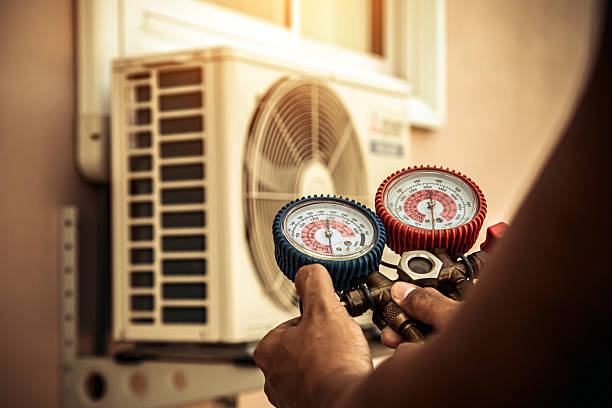 Professional Heat Pump Repair technician working in Boxborough, MA